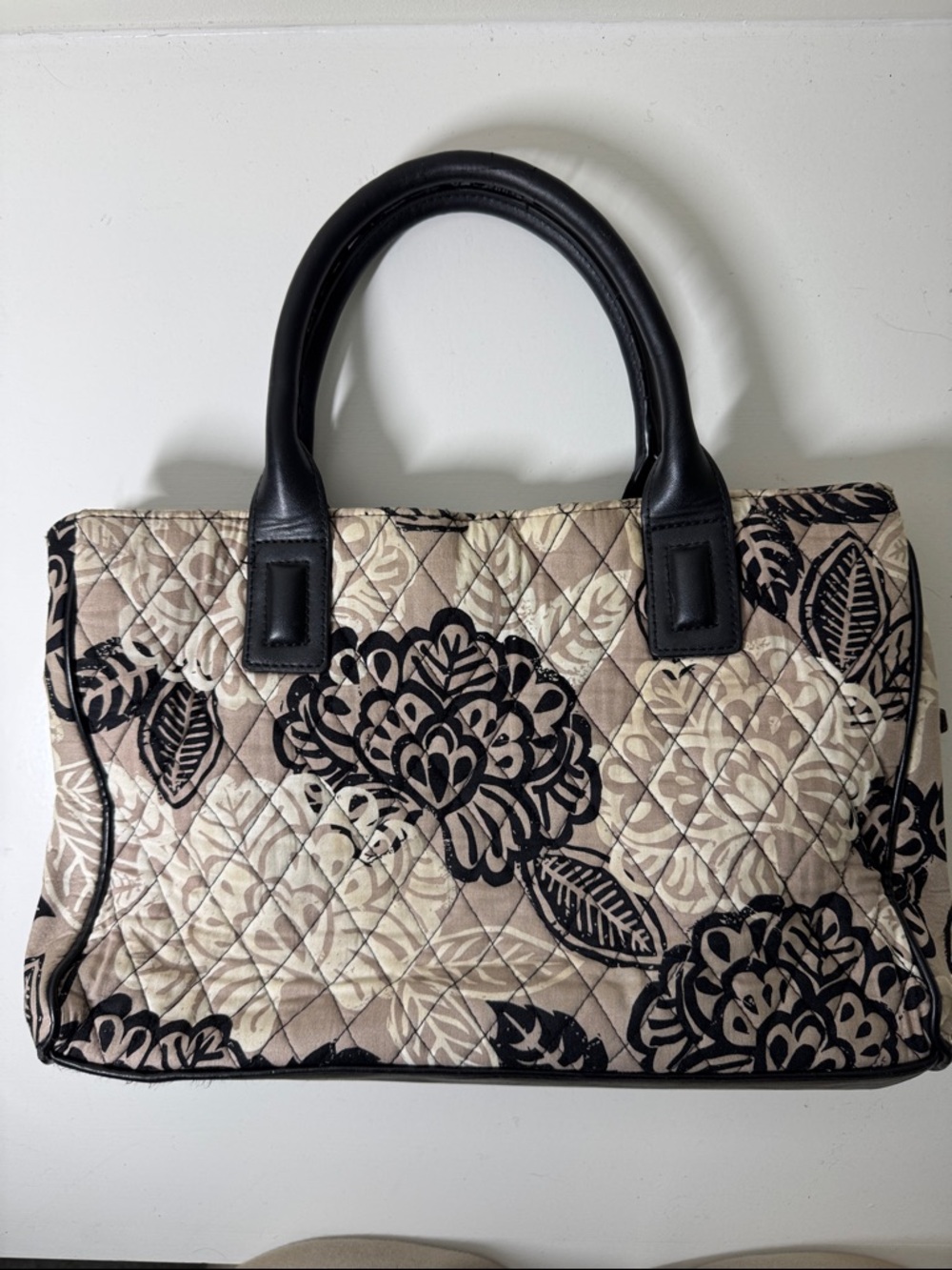 Vera Bradley black, tan, and cream fabric hand bag with leather accents.